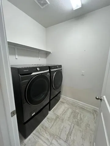 a view of a storage & utility room in a house