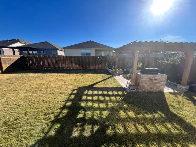 a view of swimming pool with seating area