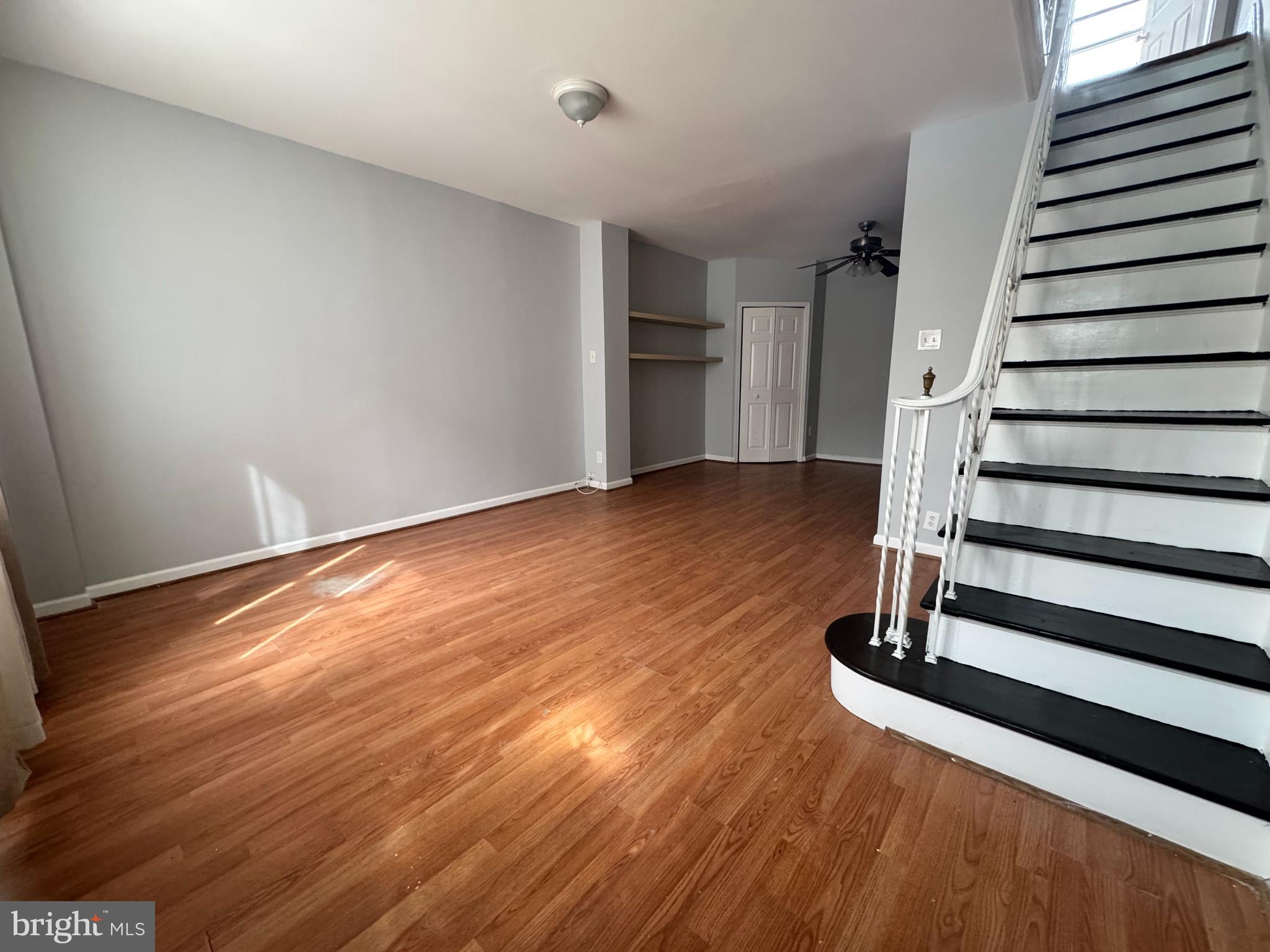 3276 Webb Street Philadelphia, PA 19134 - Photo 2 of 9 an empty room with wooden floor and windows