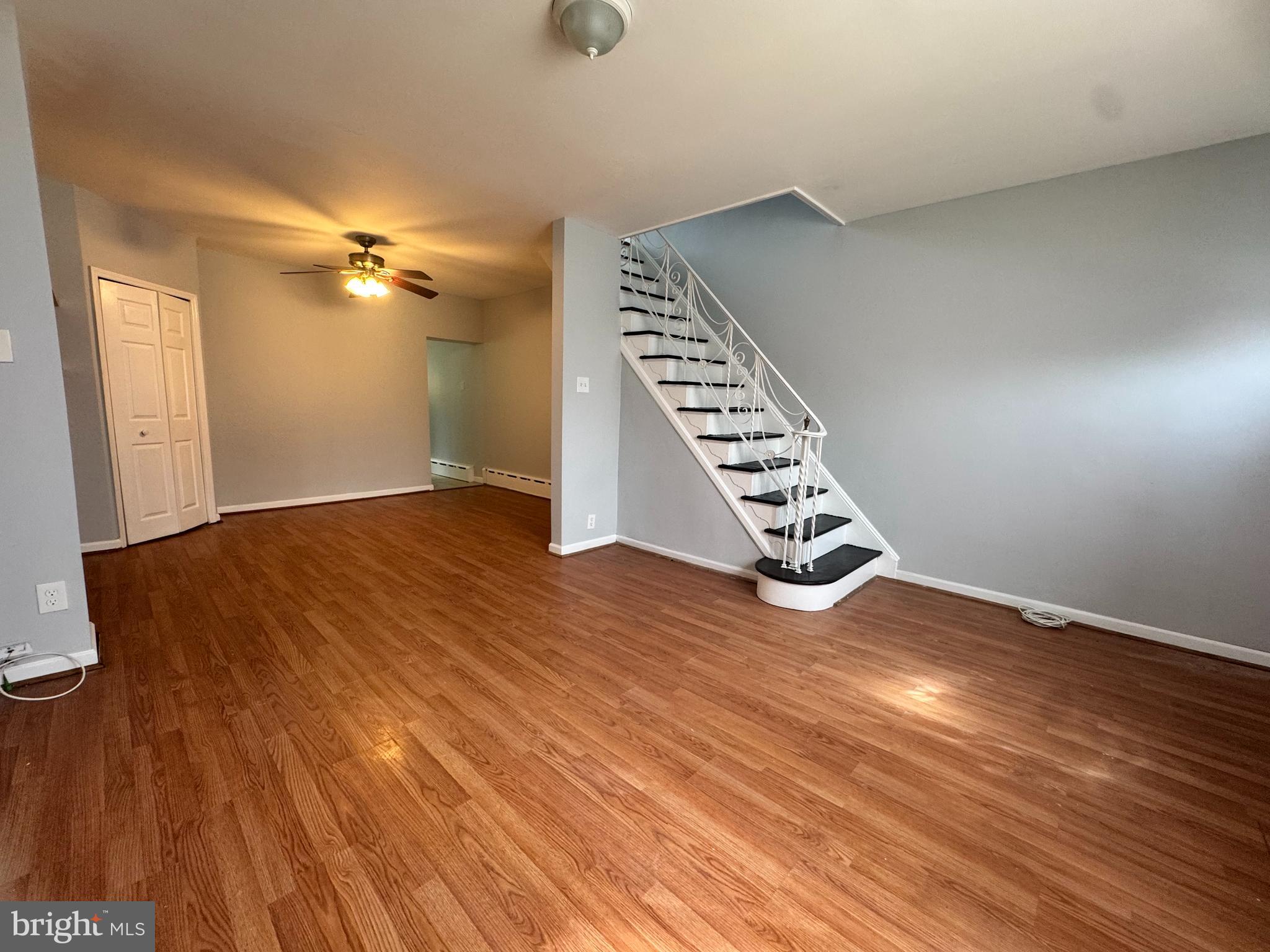3276 Webb Street Philadelphia, PA 19134 - Photo 3 of 9 an empty room with wooden floor fan and windows