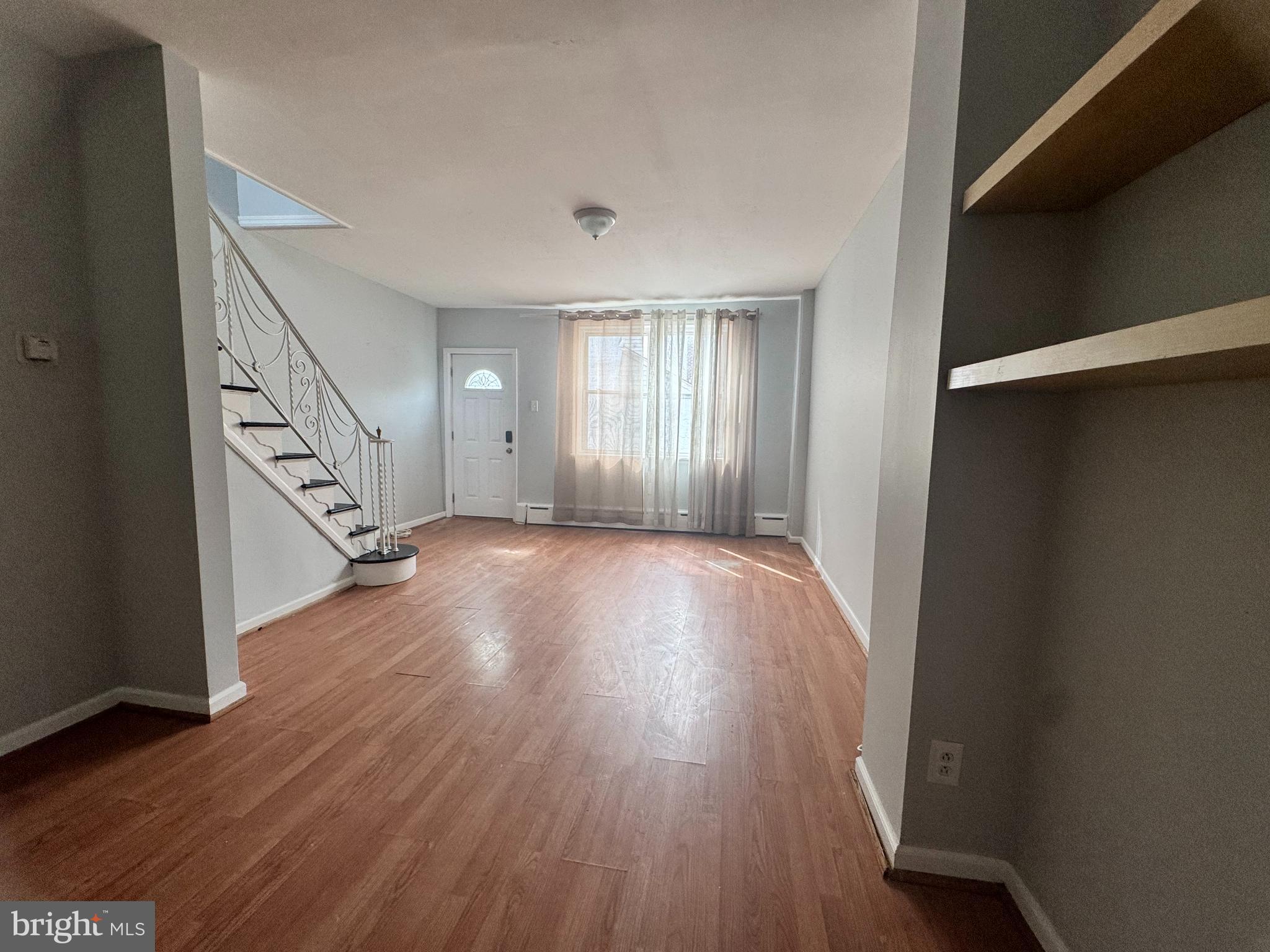 3276 Webb Street Philadelphia, PA 19134 - Photo 4 of 9 wooden floor in an empty room with a window