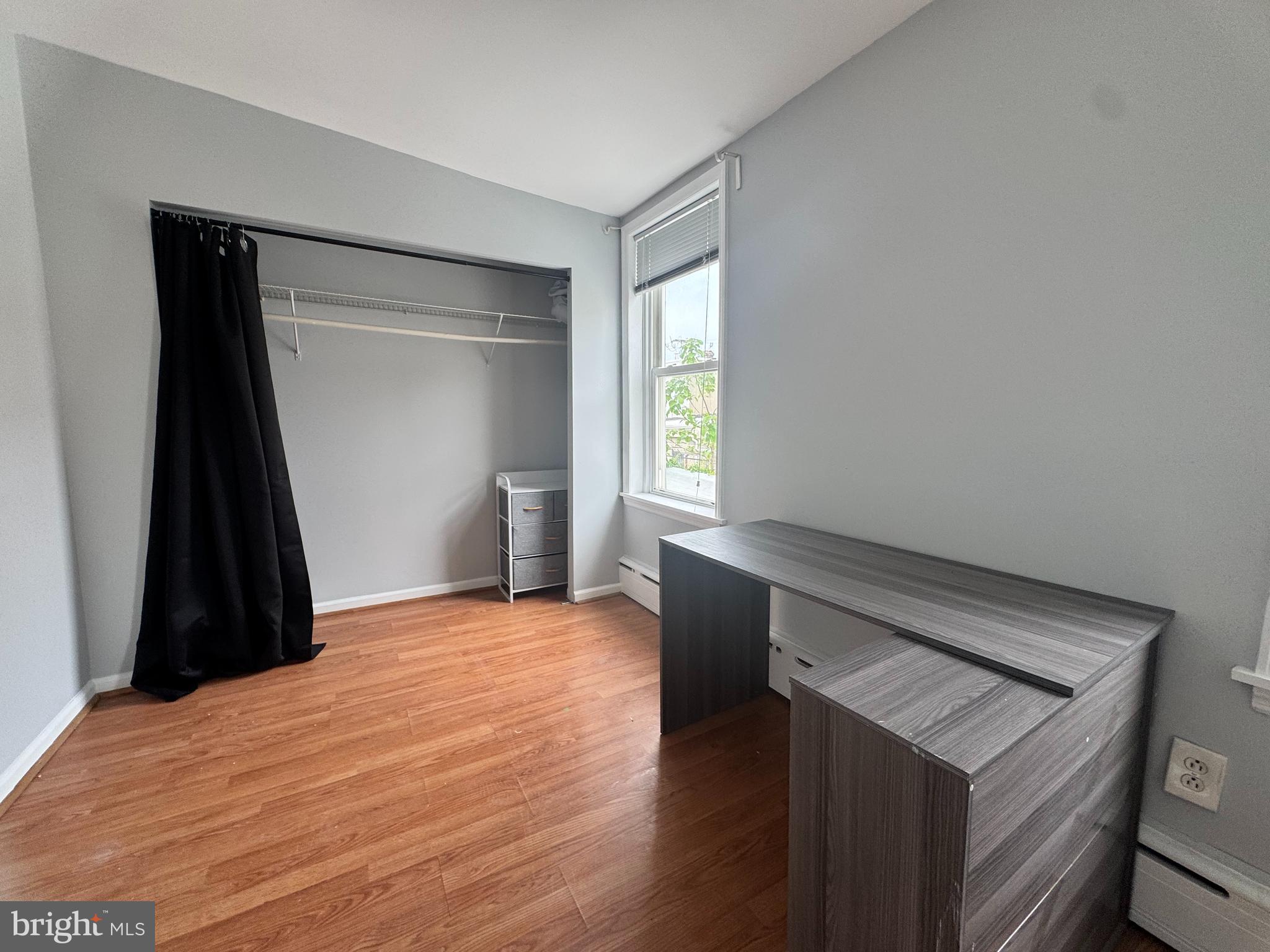 3276 Webb Street Philadelphia, PA 19134 - Photo 8 of 9 a view of empty room with wooden floor and fan