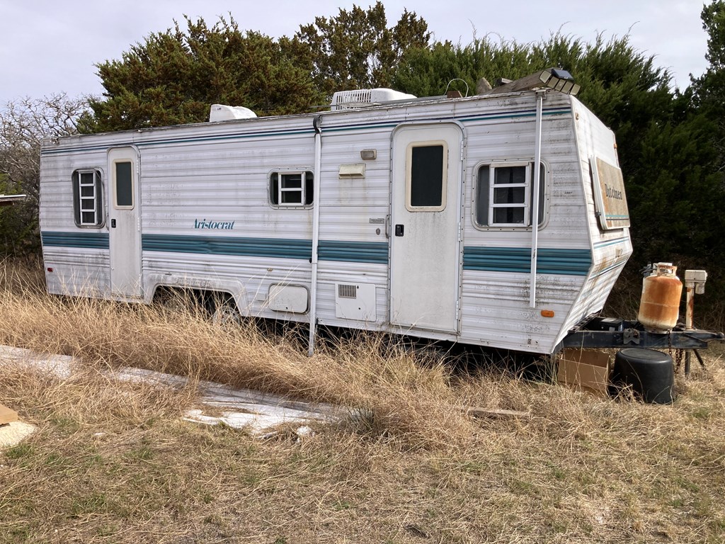 0 Tahoe Road Harper, TX 78631 - Photo 9 of 21 a view of a small house with wooden fence