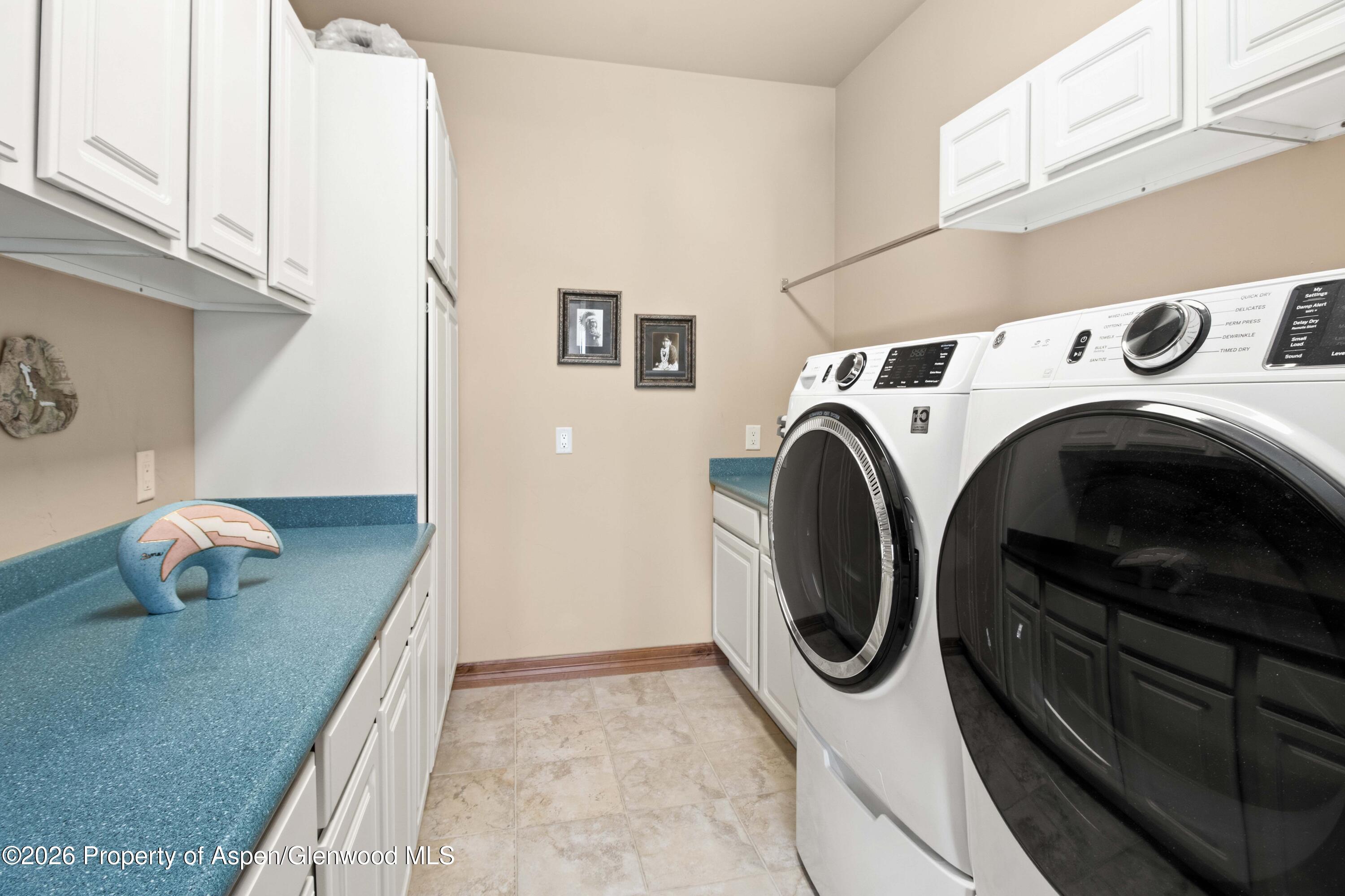 71 River View Place Parachute, CO 81635 - Photo 12 of 45 a utility room with dryer and washer
