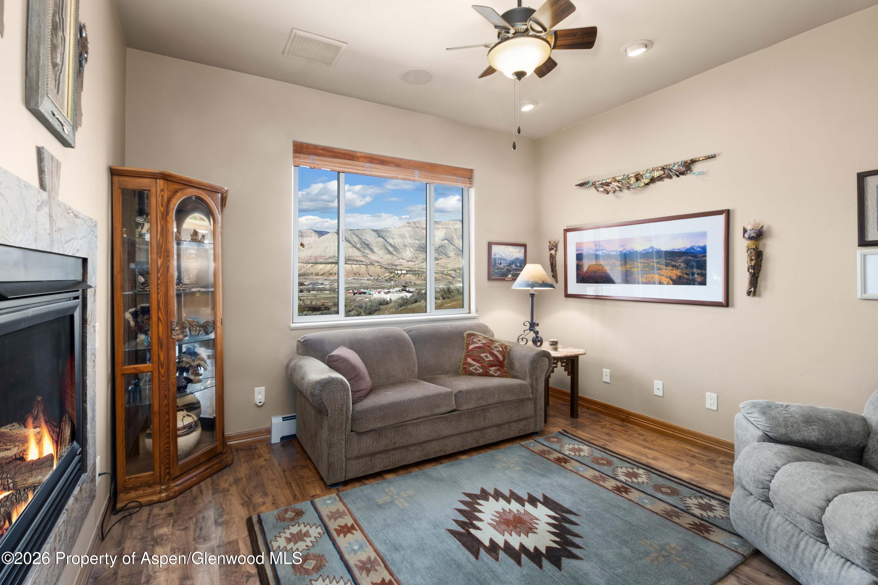 71 River View Place Parachute, CO 81635 - Photo 13 of 45 a living room with furniture and a flat screen tv