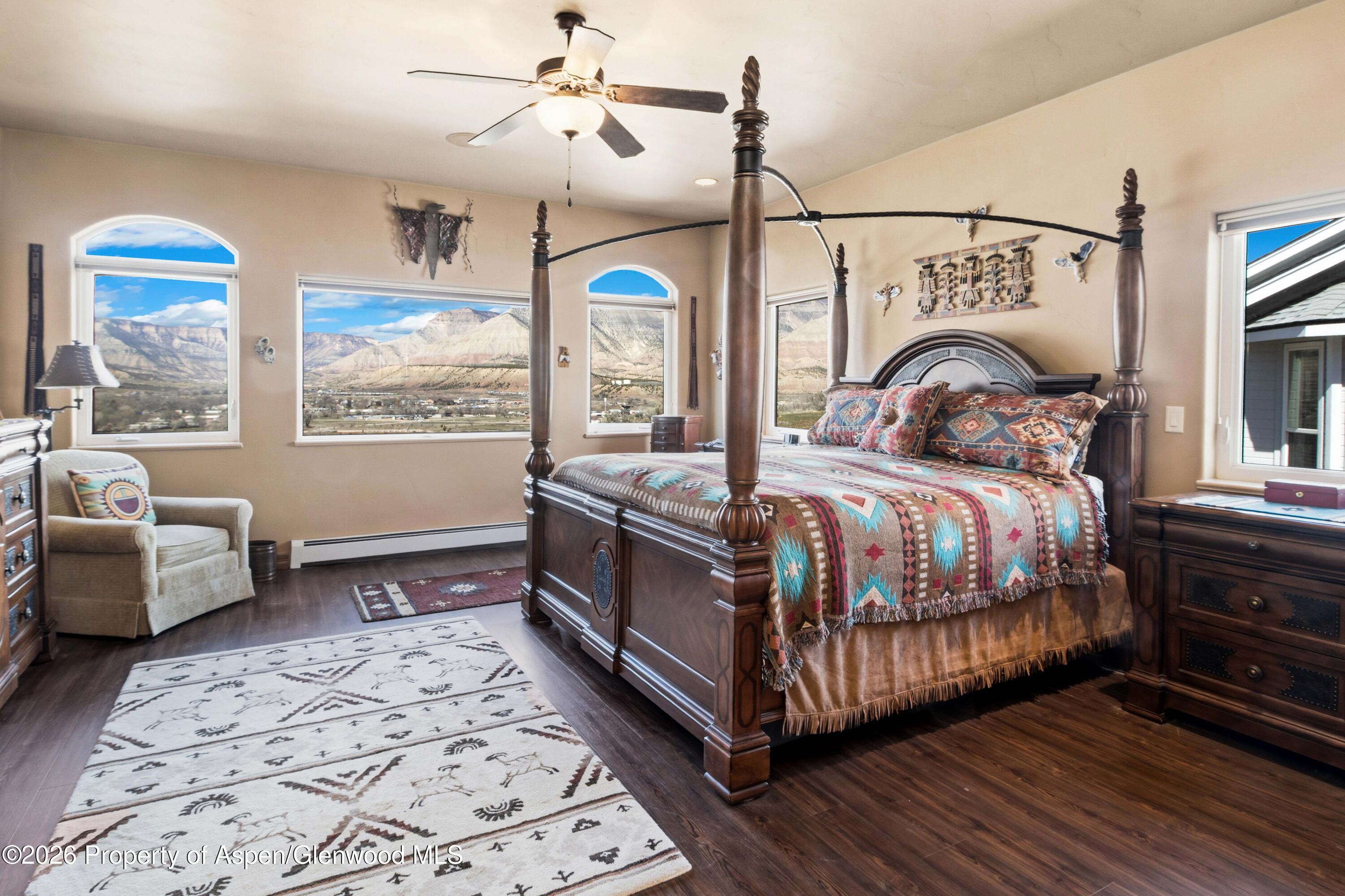 71 River View Place Parachute, CO 81635 - Photo 15 of 45 a bedroom with a bed couch and a window