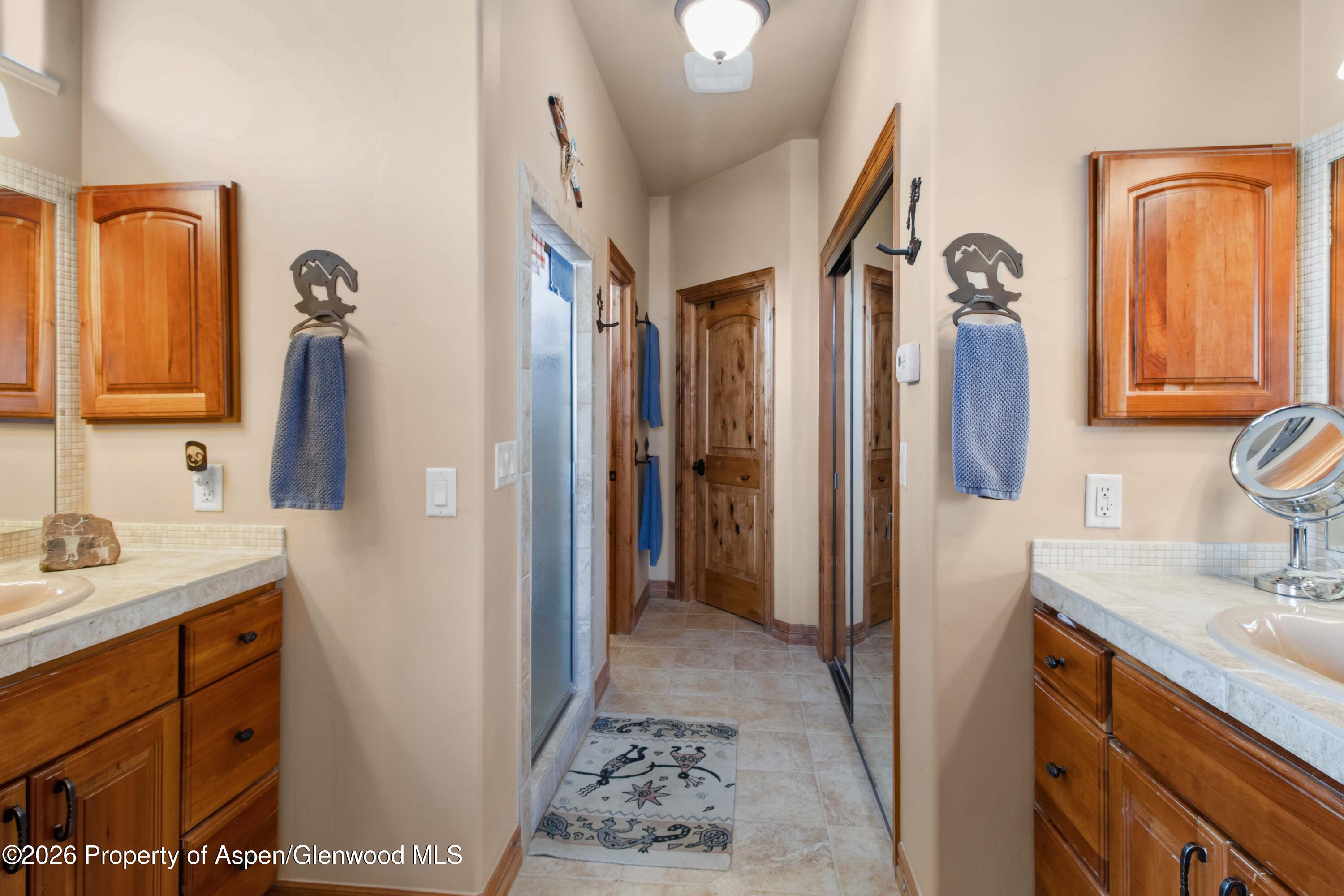 71 River View Place Parachute, CO 81635 - Photo 17 of 45 a bathroom with a sink vanity and mirror
