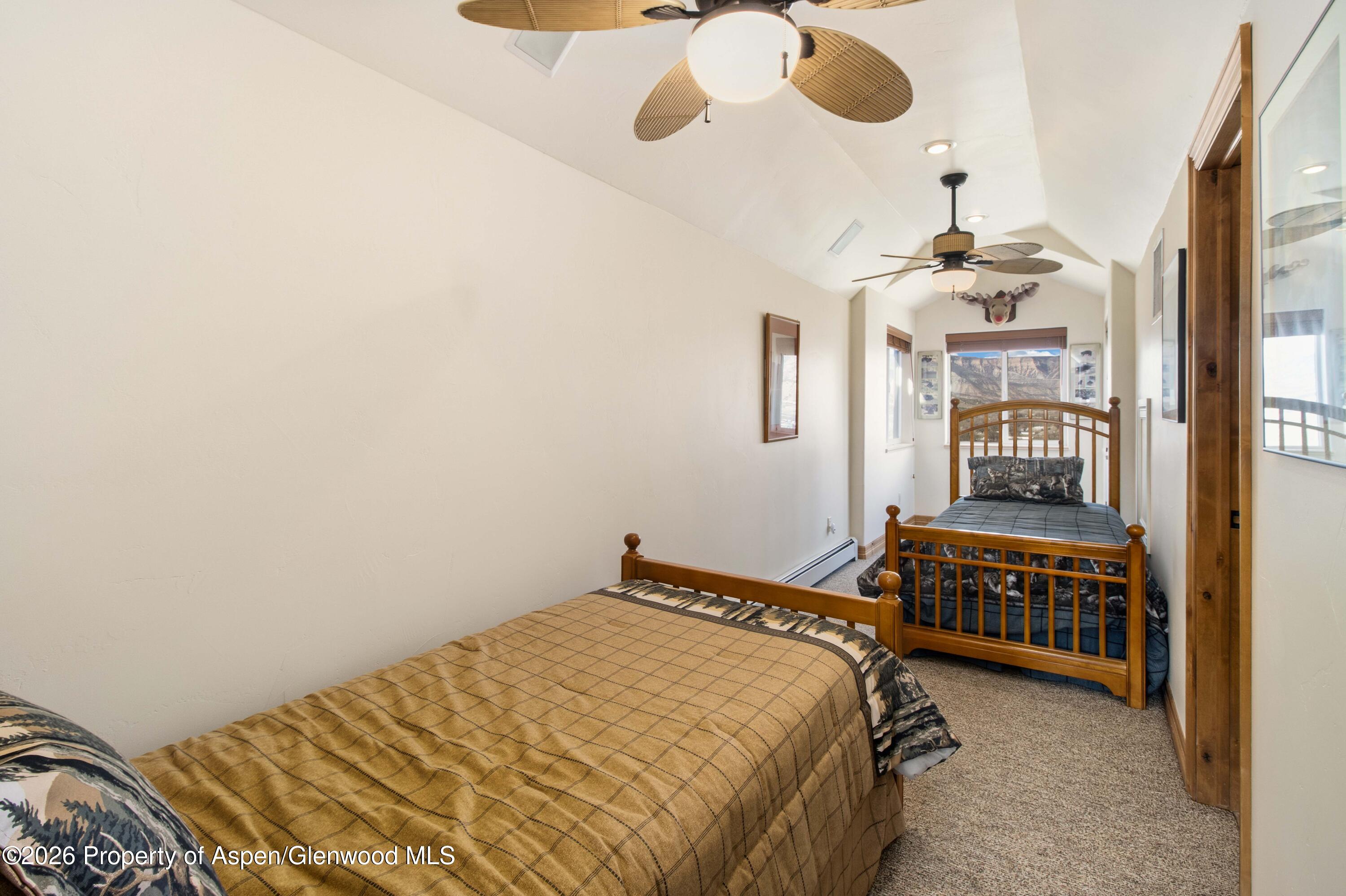 71 River View Place Parachute, CO 81635 - Photo 20 of 45 a bedroom with a bed and cabinets
