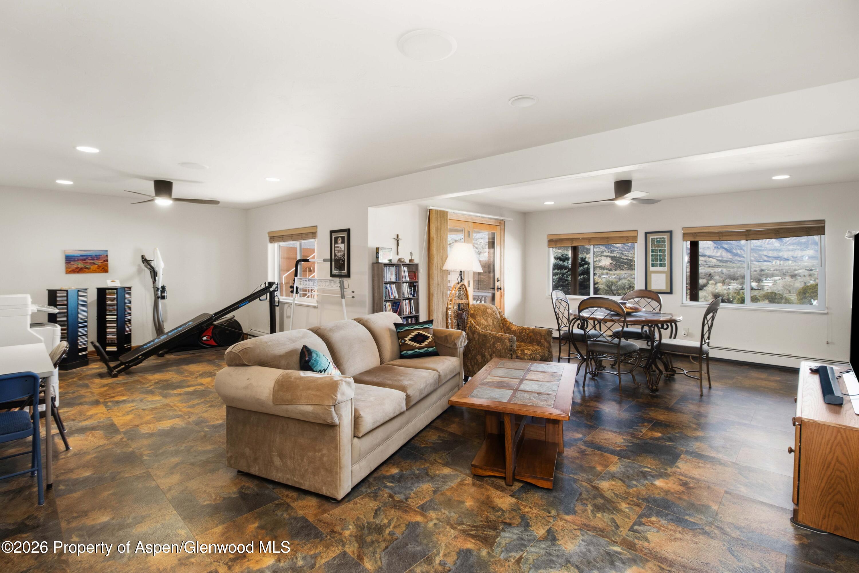 71 River View Place Parachute, CO 81635 - Photo 23 of 45 a living room with furniture and a large window