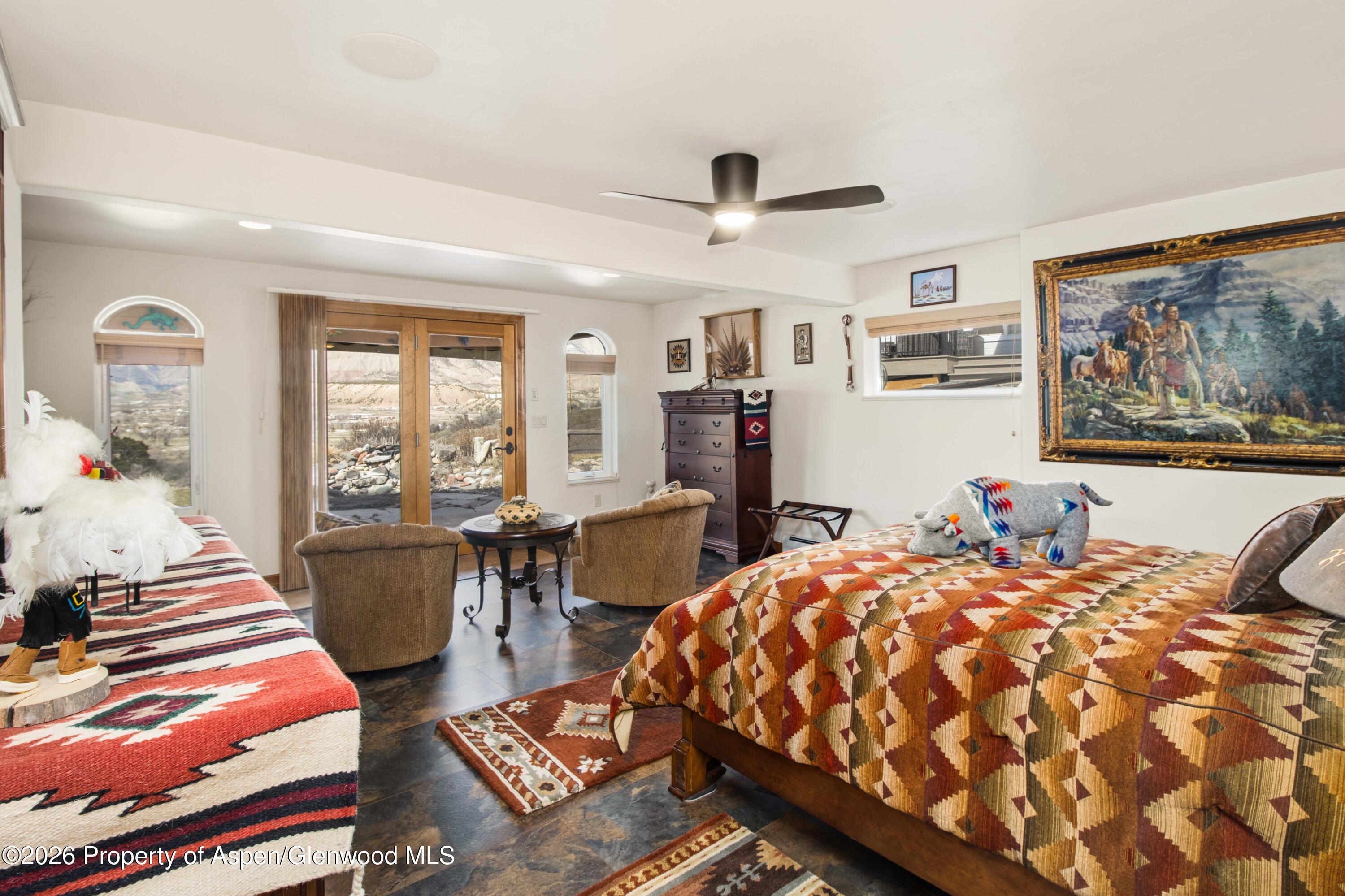71 River View Place Parachute, CO 81635 - Photo 30 of 45 a bed room with a bed and wooden floor