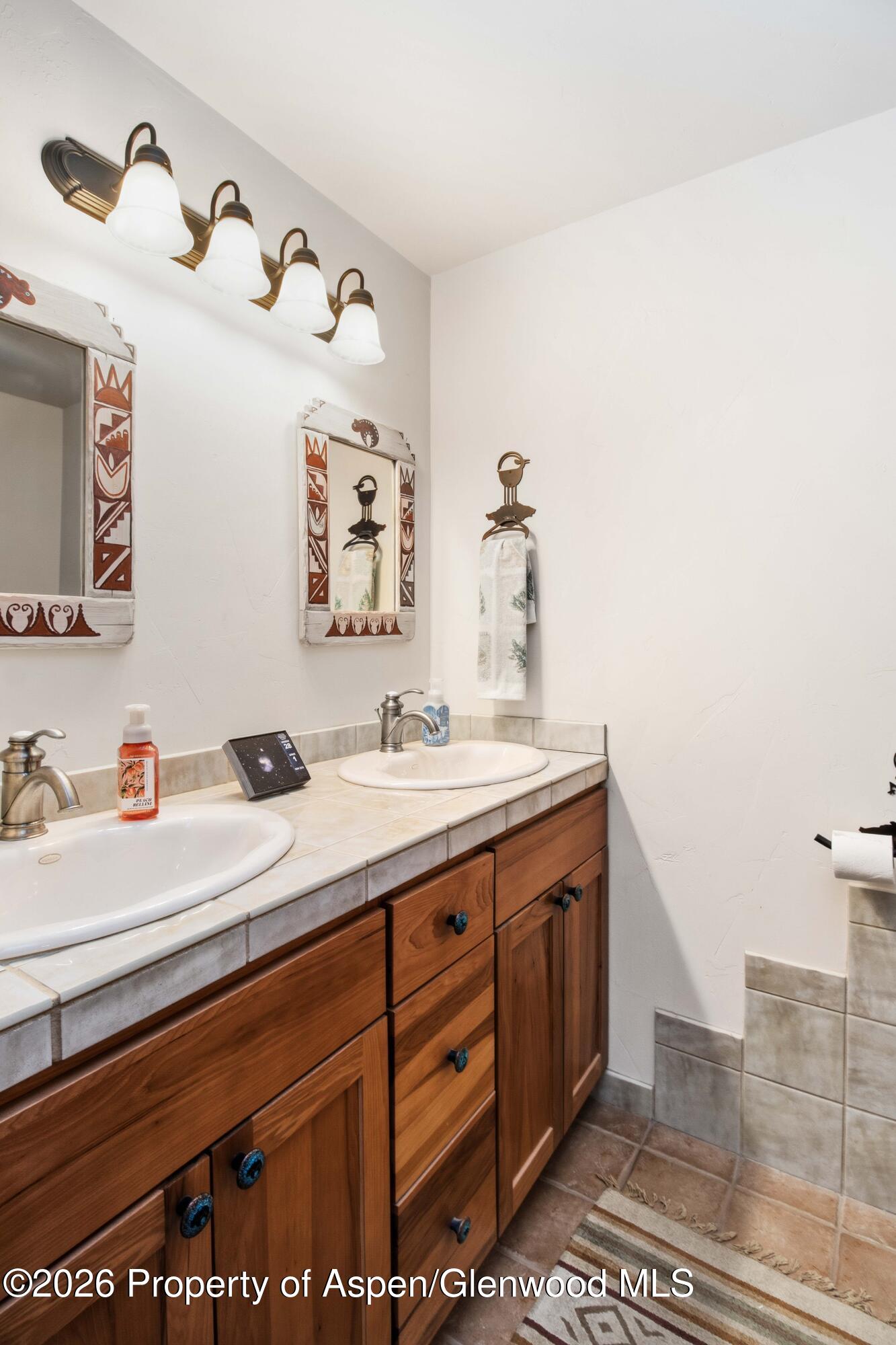 71 River View Place Parachute, CO 81635 - Photo 31 of 45 a bathroom with a sink and a mirror