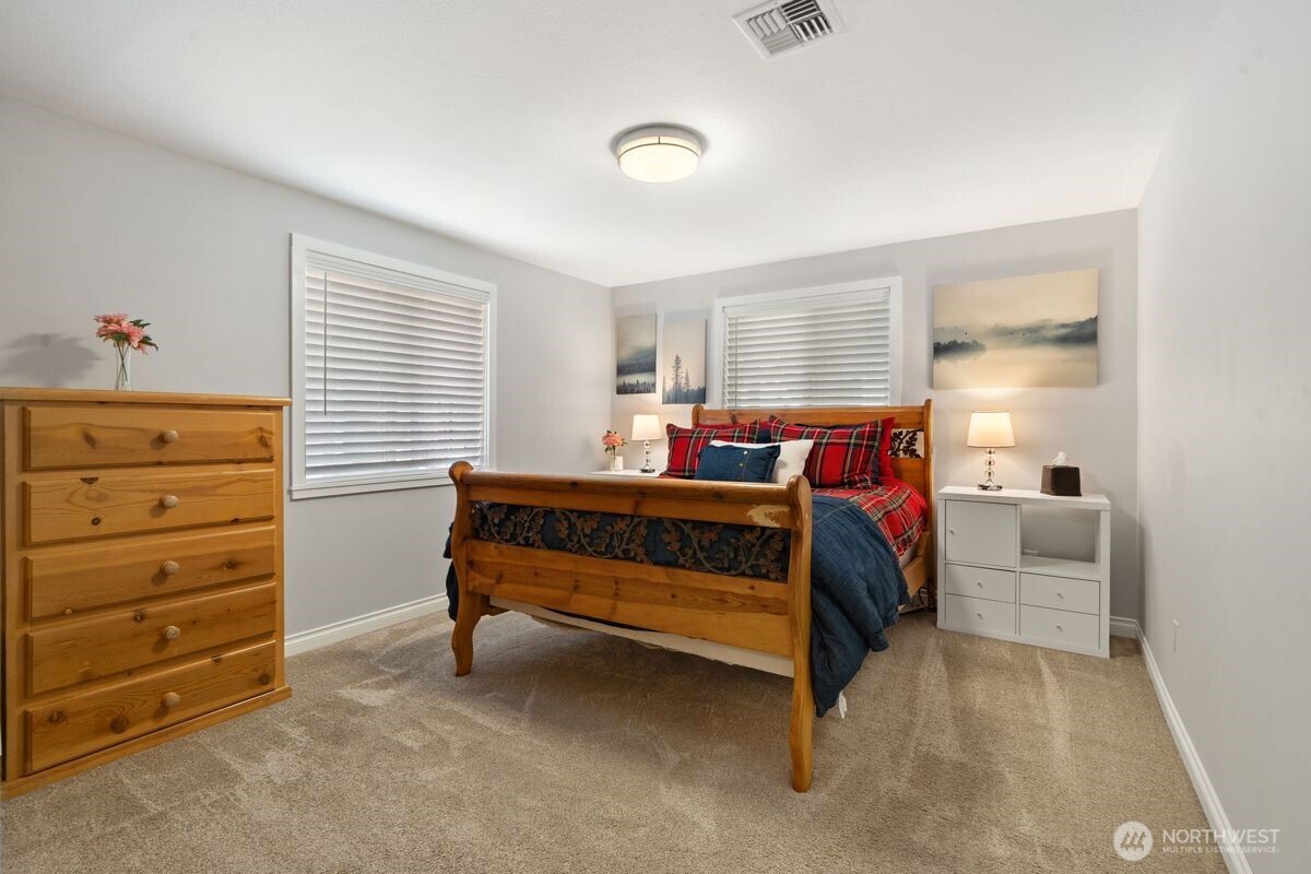 560 Mountain Trail Road Brinnon, WA 98320 - Photo 13 of 40 a bedroom with a bed and a dresser