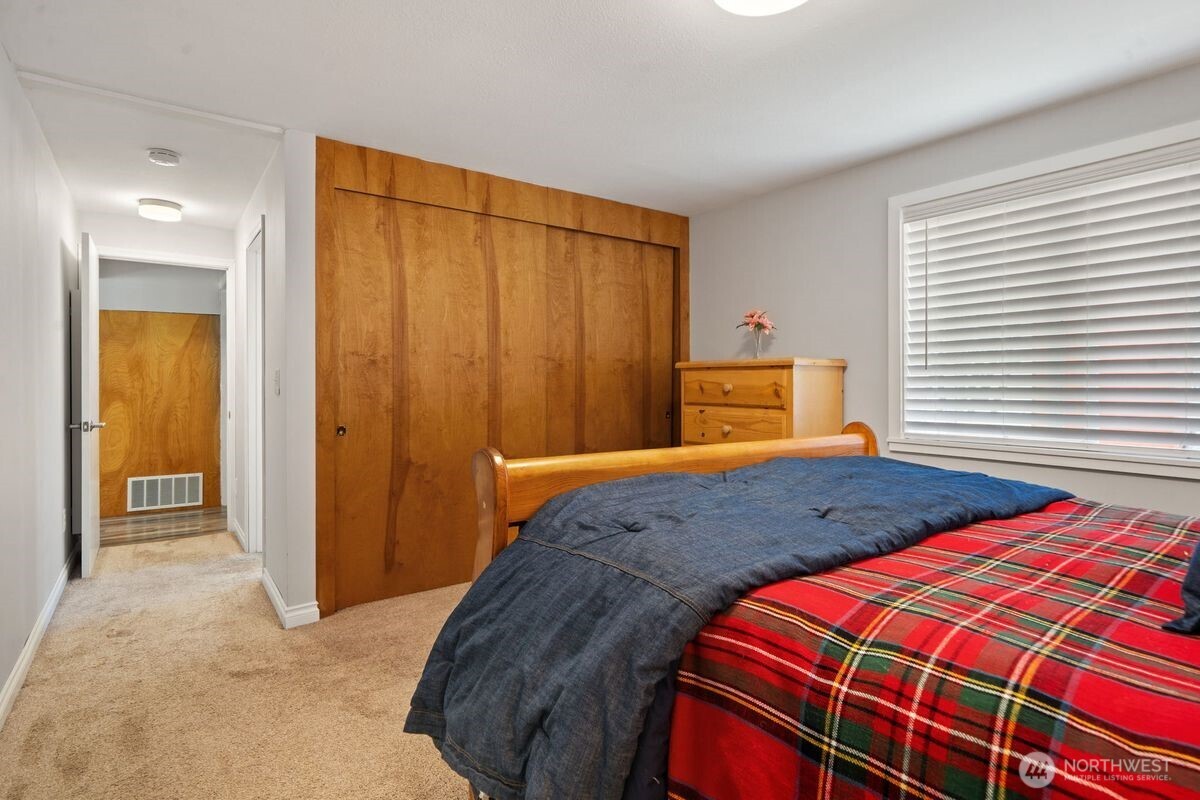 560 Mountain Trail Road Brinnon, WA 98320 - Photo 14 of 40 a bedroom with a bed and a window