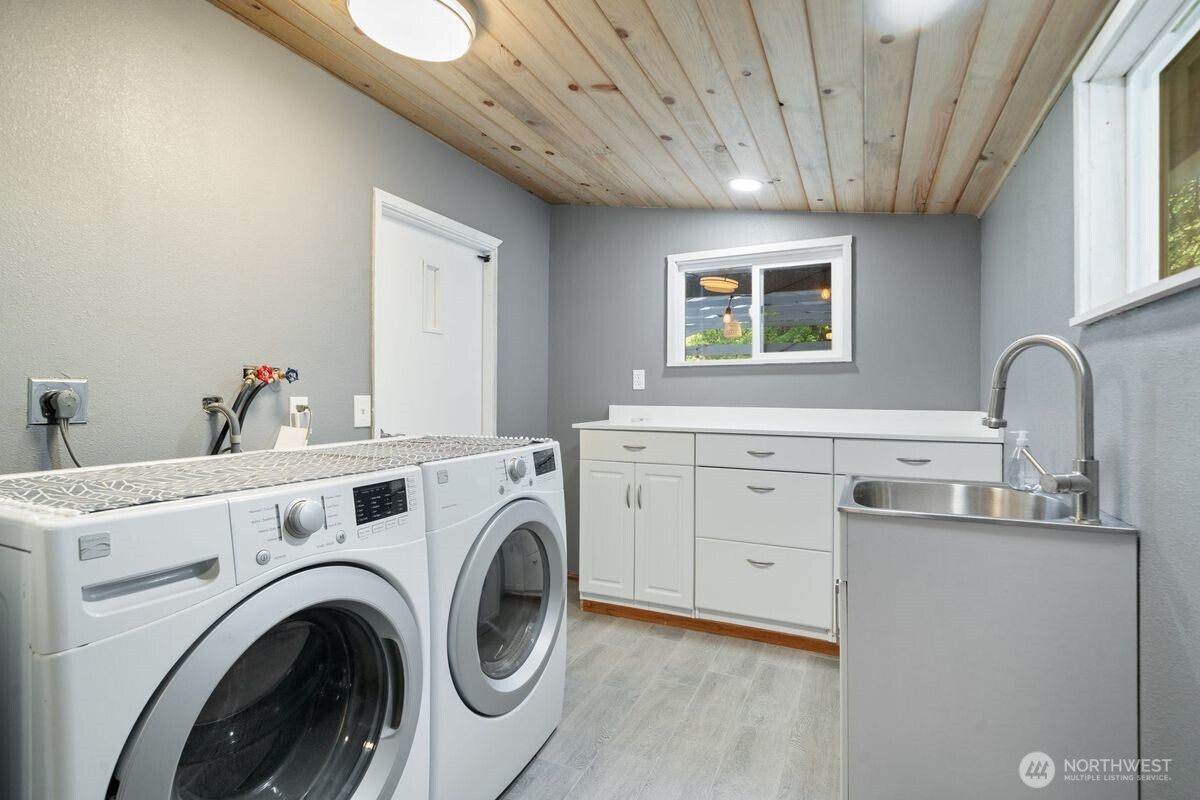 560 Mountain Trail Road Brinnon, WA 98320 - Photo 28 of 40 a view of storage and utility room with washer and dryer