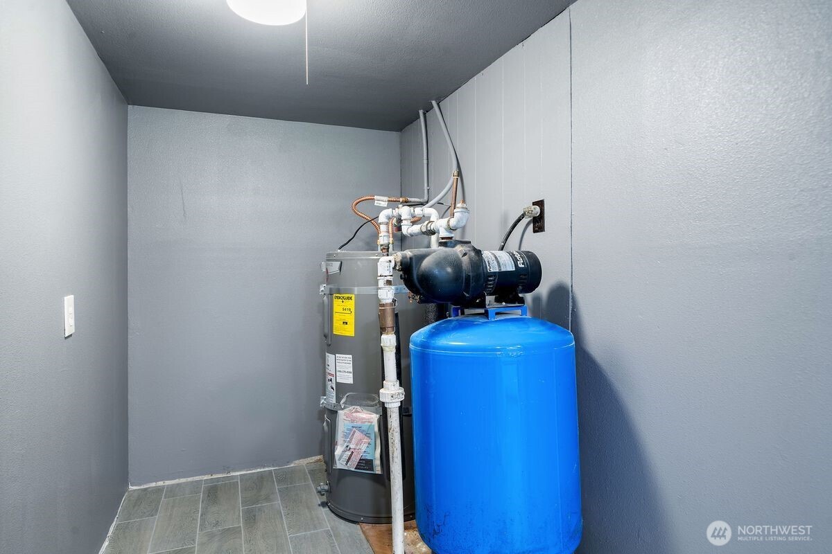 560 Mountain Trail Road Brinnon, WA 98320 - Photo 29 of 40 a view of storage and utility room with refrigerator