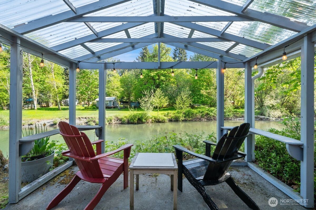 560 Mountain Trail Road Brinnon, WA 98320 - Photo 3 of 40 a patio view with a outdoor seating space