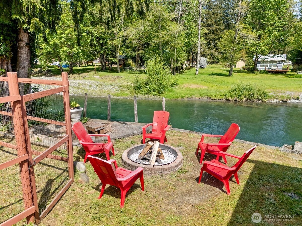 560 Mountain Trail Road Brinnon, WA 98320 - Photo 31 of 40 a patio with water view fountain and trees