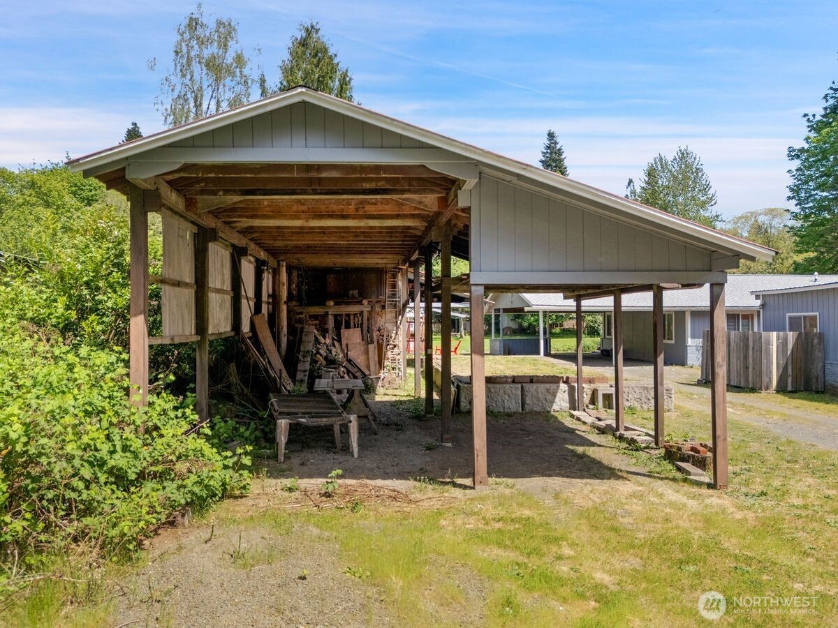 560 Mountain Trail Road Brinnon, WA 98320 - Photo 5 of 40 a view of a chairs and table in the patio