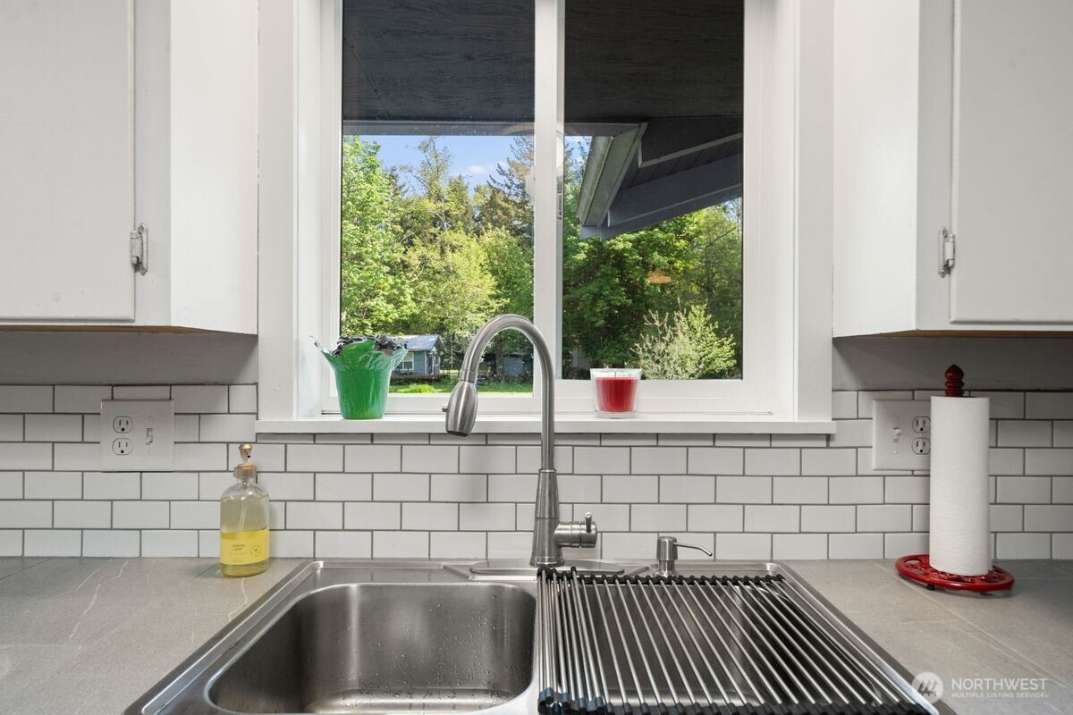 560 Mountain Trail Road Brinnon, WA 98320 - Photo 9 of 40 a kitchen with a sink and a window