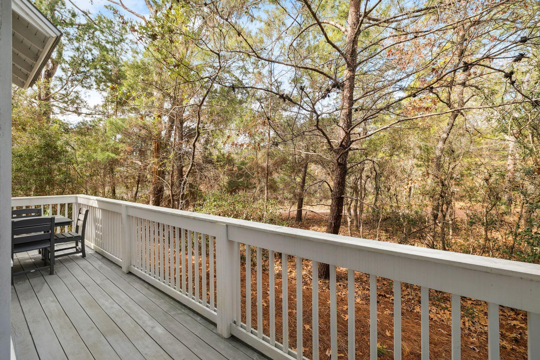 167 Milestone Drive, Unit A Inlet Beach, FL 32461 - Photo 15 of 29 a view of balcony with wooden floor and fence