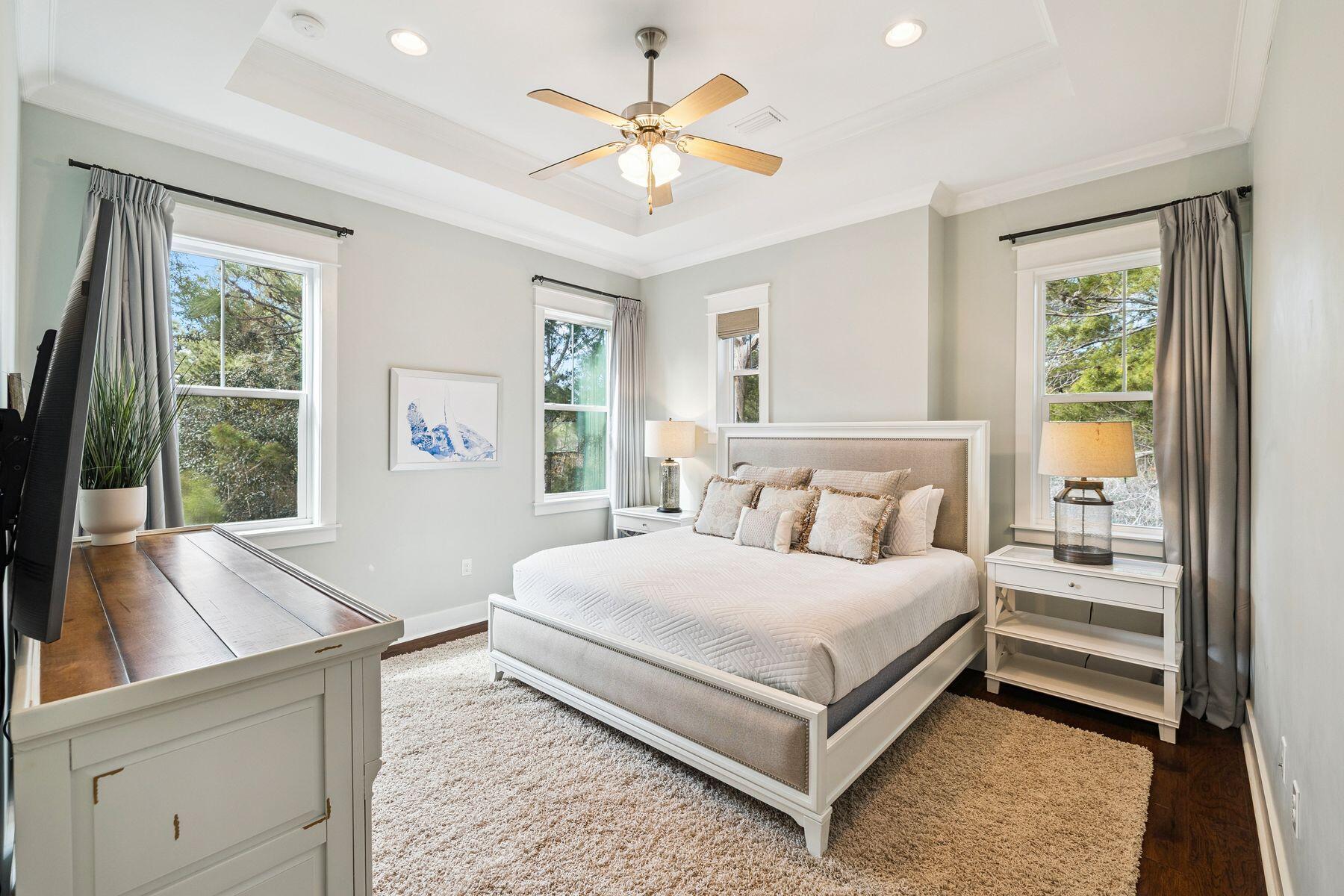 167 Milestone Drive, Unit A Inlet Beach, FL 32461 - Photo 17 of 29 a bedroom with a large bed and a large window