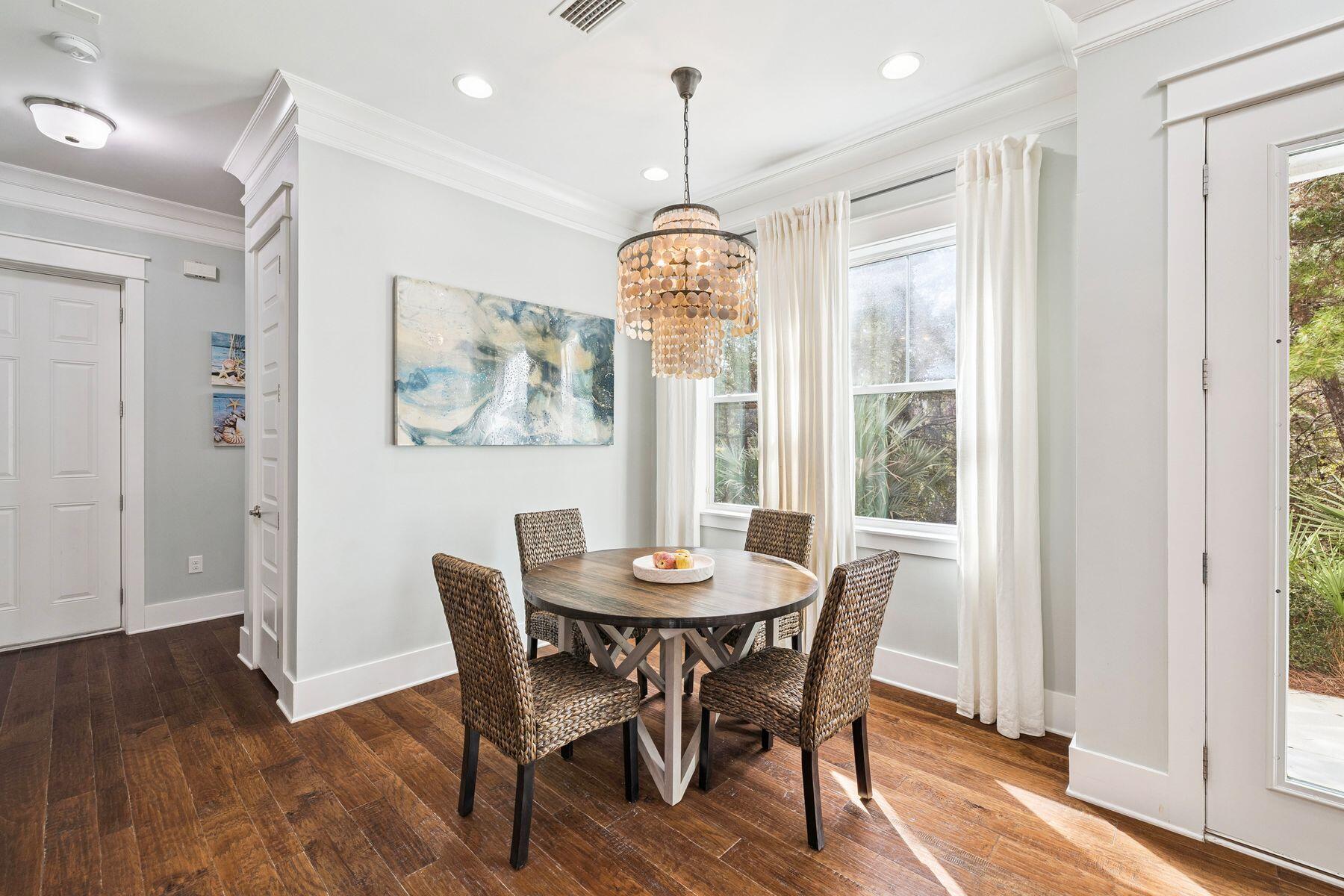 167 Milestone Drive, Unit A Inlet Beach, FL 32461 - Photo 10 of 29 a dining room with furniture window wooden floor