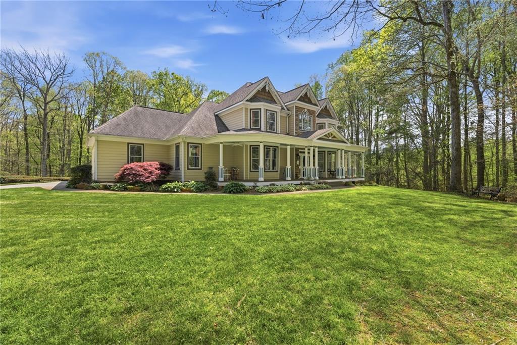 4829 Old Pendergrass Road Jefferson, GA 30549 - Photo 3 of 55 a front view of a house with garden