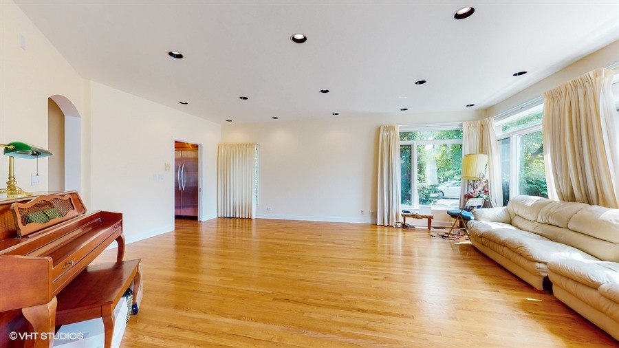 240 Hibbard Road Wilmette, IL 60091 - Photo 11 of 42 a living room with furniture and large windows