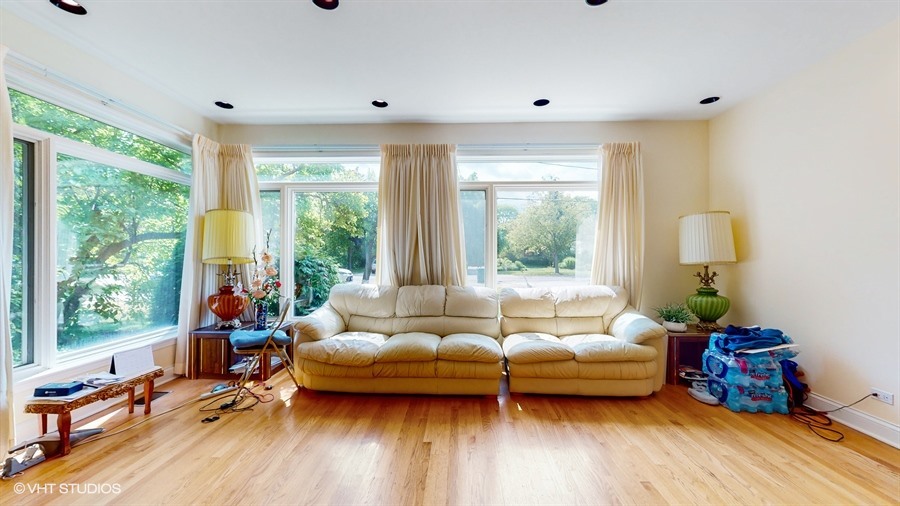 240 Hibbard Road Wilmette, IL 60091 - Photo 13 of 42 a living room with furniture and a large window