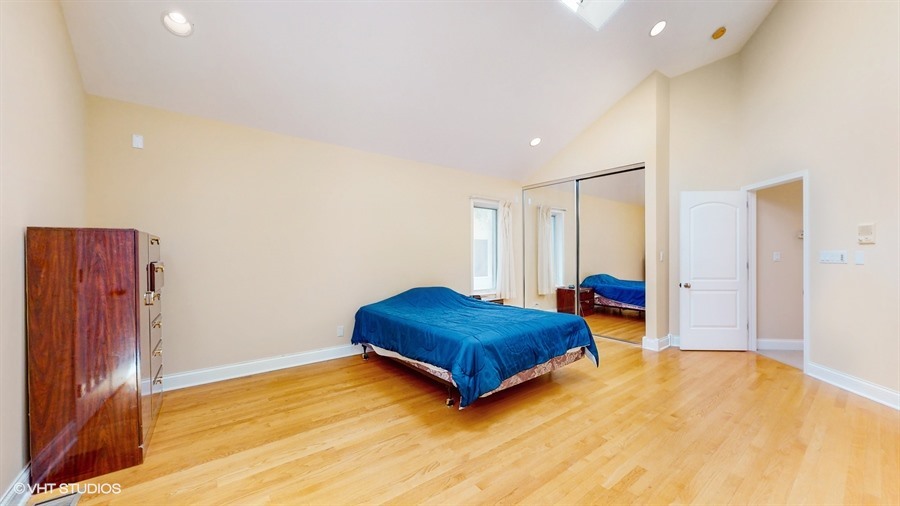 240 Hibbard Road Wilmette, IL 60091 - Photo 16 of 42 a living room with a bed and a dresser