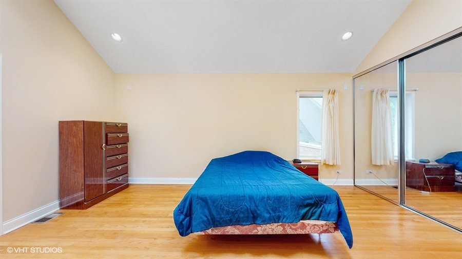 240 Hibbard Road Wilmette, IL 60091 - Photo 17 of 42 a bedroom with a bed and a closet