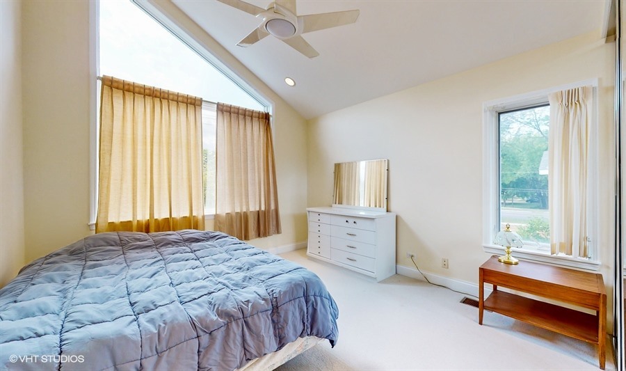 240 Hibbard Road Wilmette, IL 60091 - Photo 22 of 42 a bedroom with a bed and a window