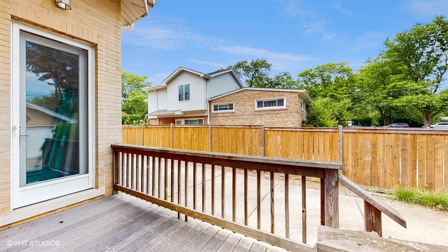 240 Hibbard Road Wilmette, IL 60091 - Photo 39 of 42 a view of a houses with a balcony