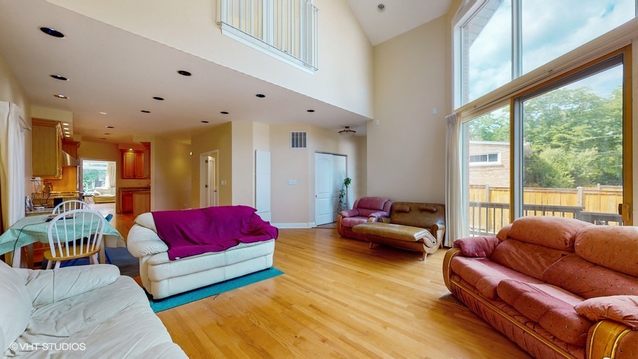 240 Hibbard Road Wilmette, IL 60091 - Photo 4 of 42 a living room with furniture and a large window