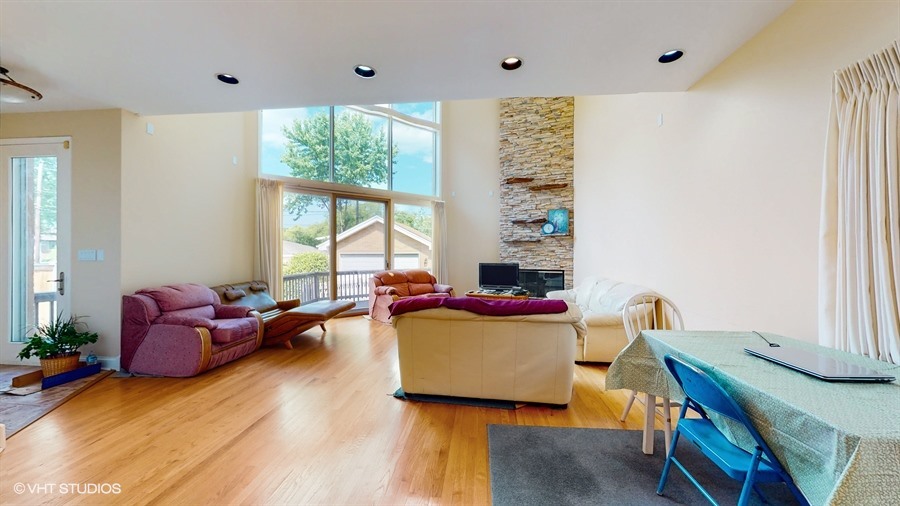 240 Hibbard Road Wilmette, IL 60091 - Photo 5 of 42 a living room with furniture and a large window
