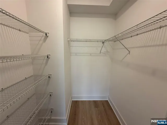 a view of a room with racks on the wall