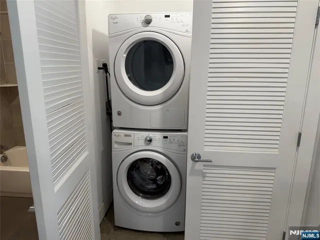 a view of a hallway with washer and dryer