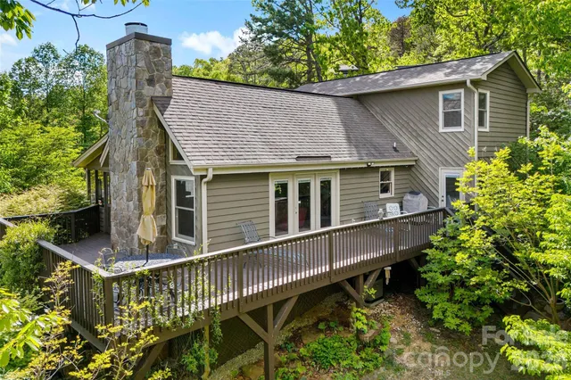 a balcony with furniture and wooden floor