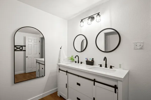 a bathroom with a sink and a mirror