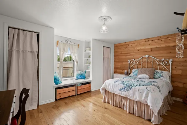 a bedroom with a bed and a window