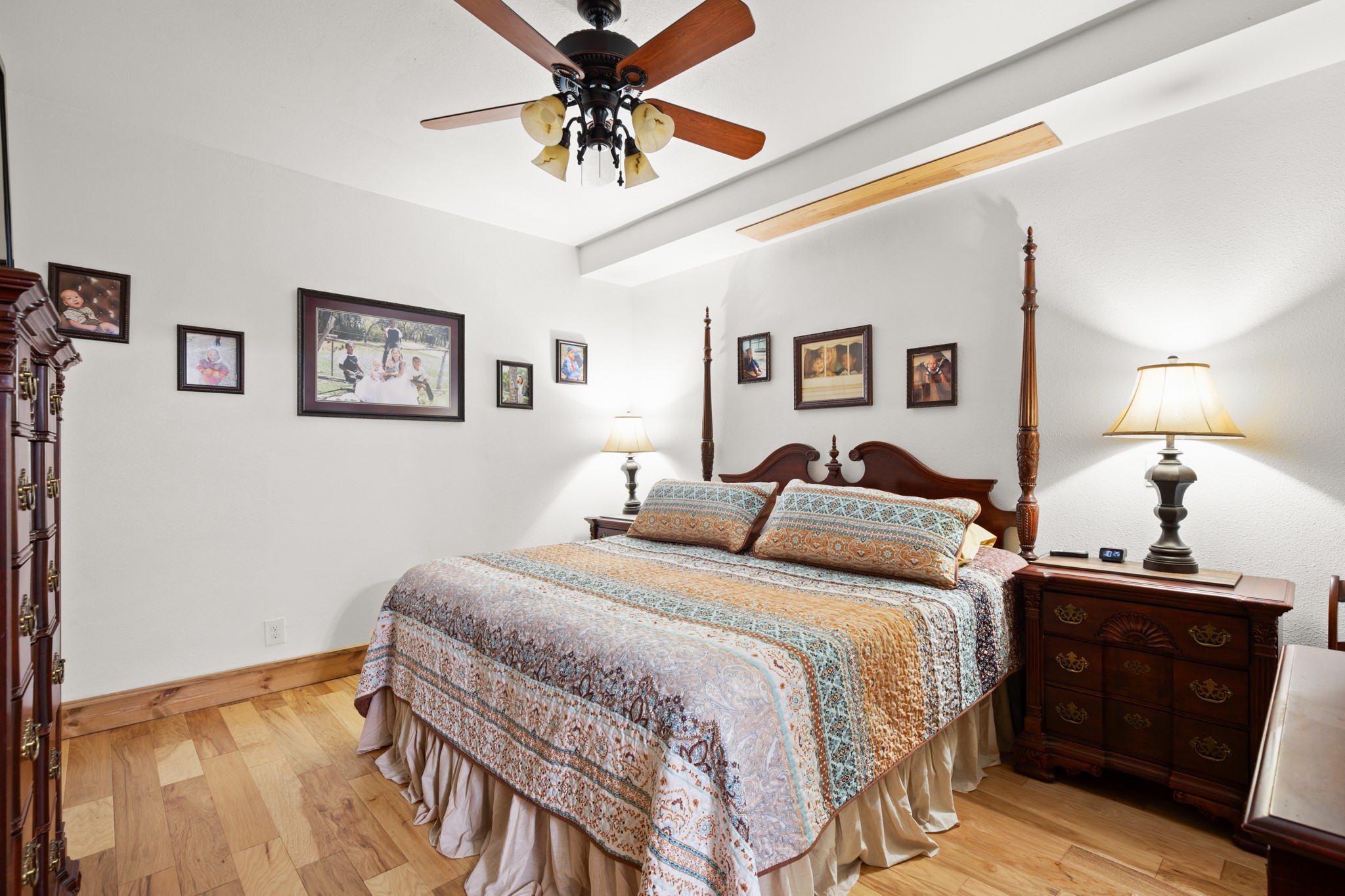 320 Pecan 3 Florence, TX 76527 - Photo 26 of 40 a bedroom with a bed and wooden floor