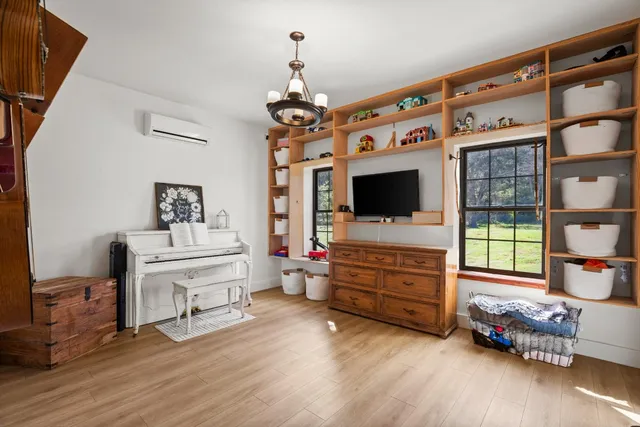 a view of living room with furniture and flat screen tv