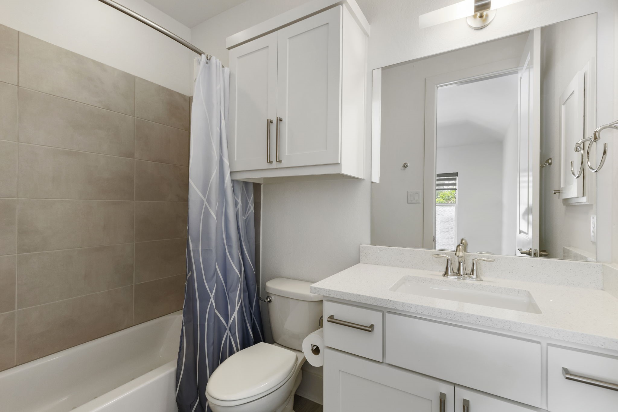 3918 Almond Court Spring, TX 77386 - Photo 29 of 42 a bathroom with a sink a toilet and shower