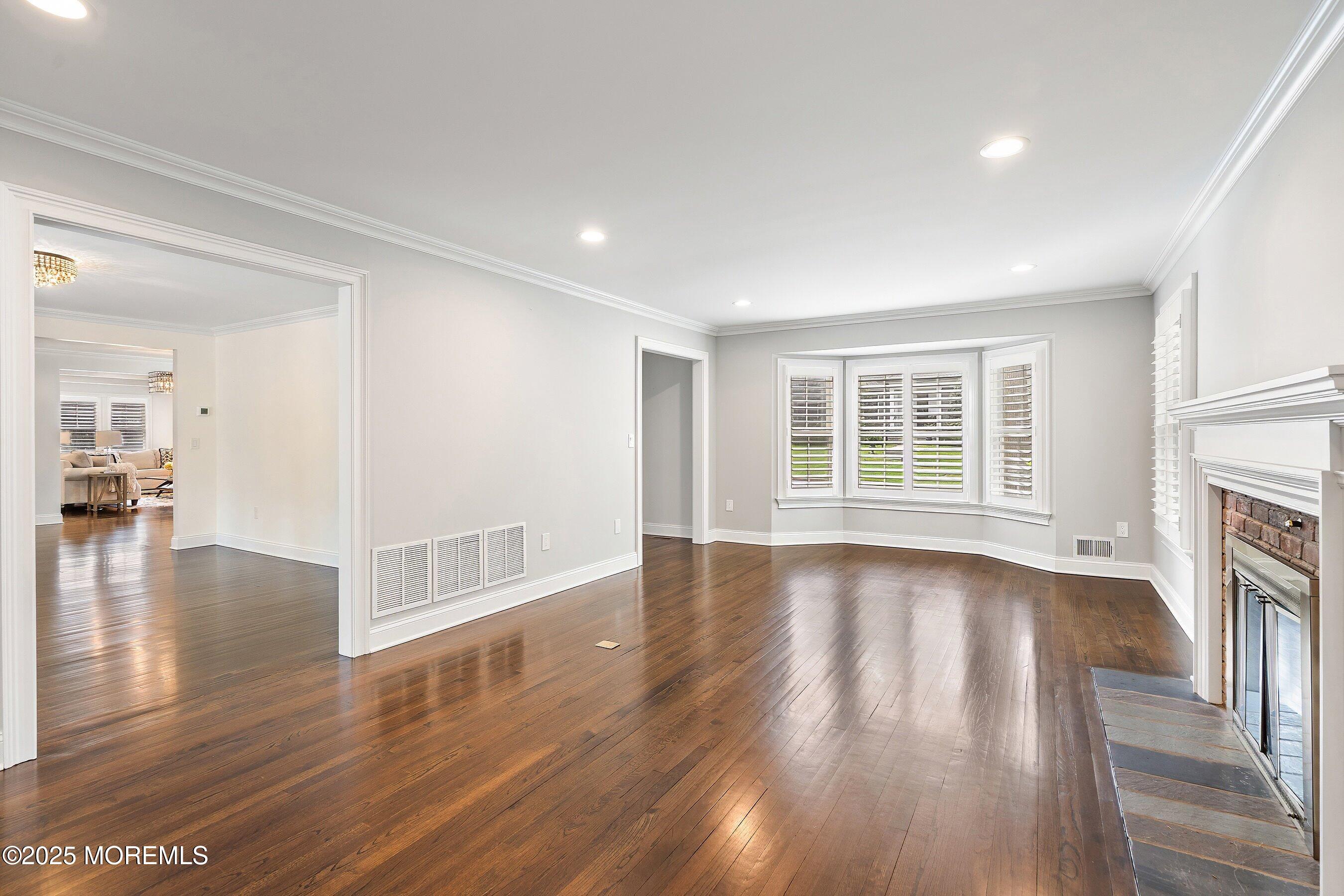 20 Rustic Terrace Fair Haven, NJ 07704 - Photo 12 of 40 a view of empty room with wooden floor and fireplace