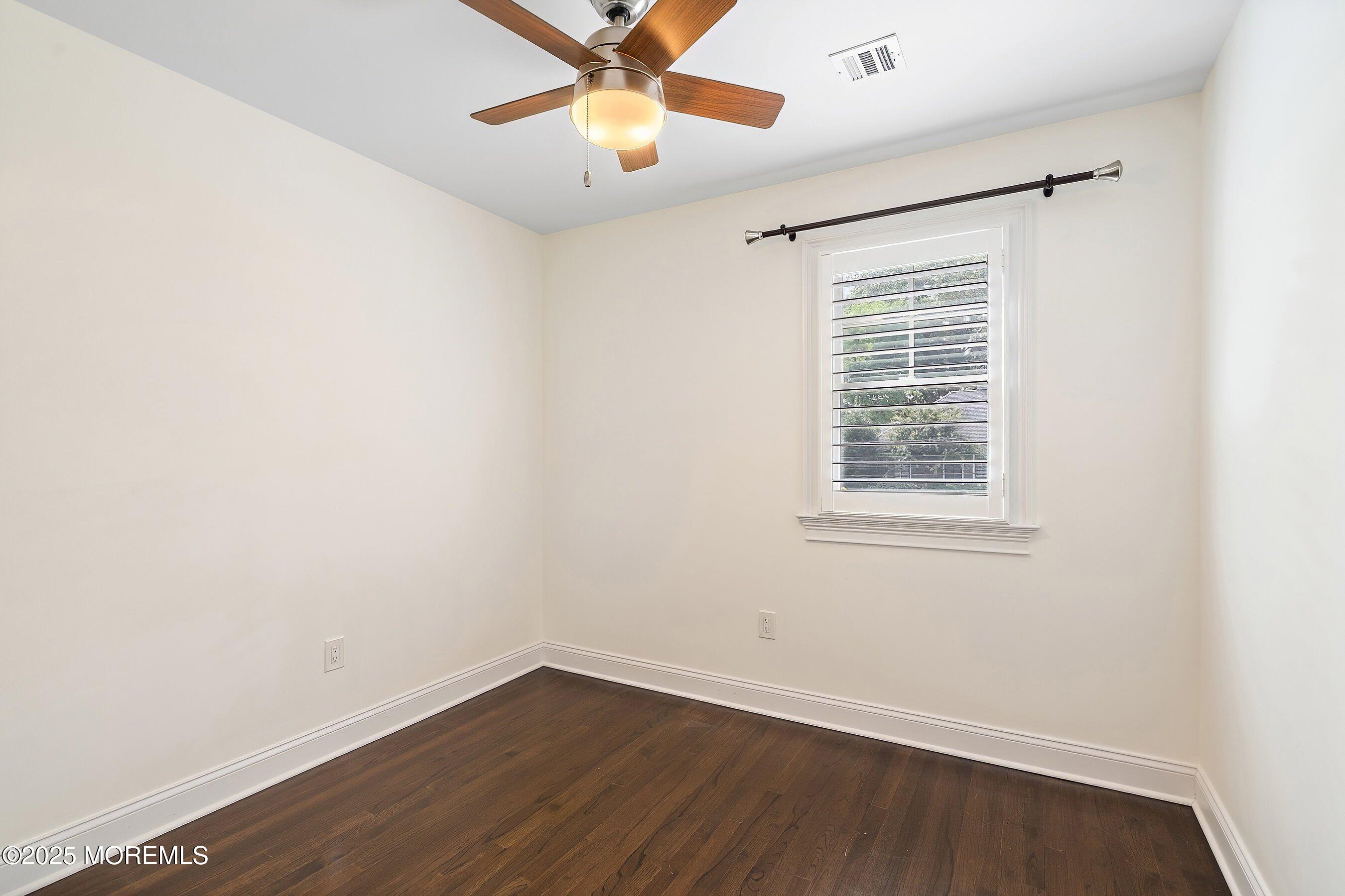 20 Rustic Terrace Fair Haven, NJ 07704 - Photo 19 of 40 an empty room with a window and a fan