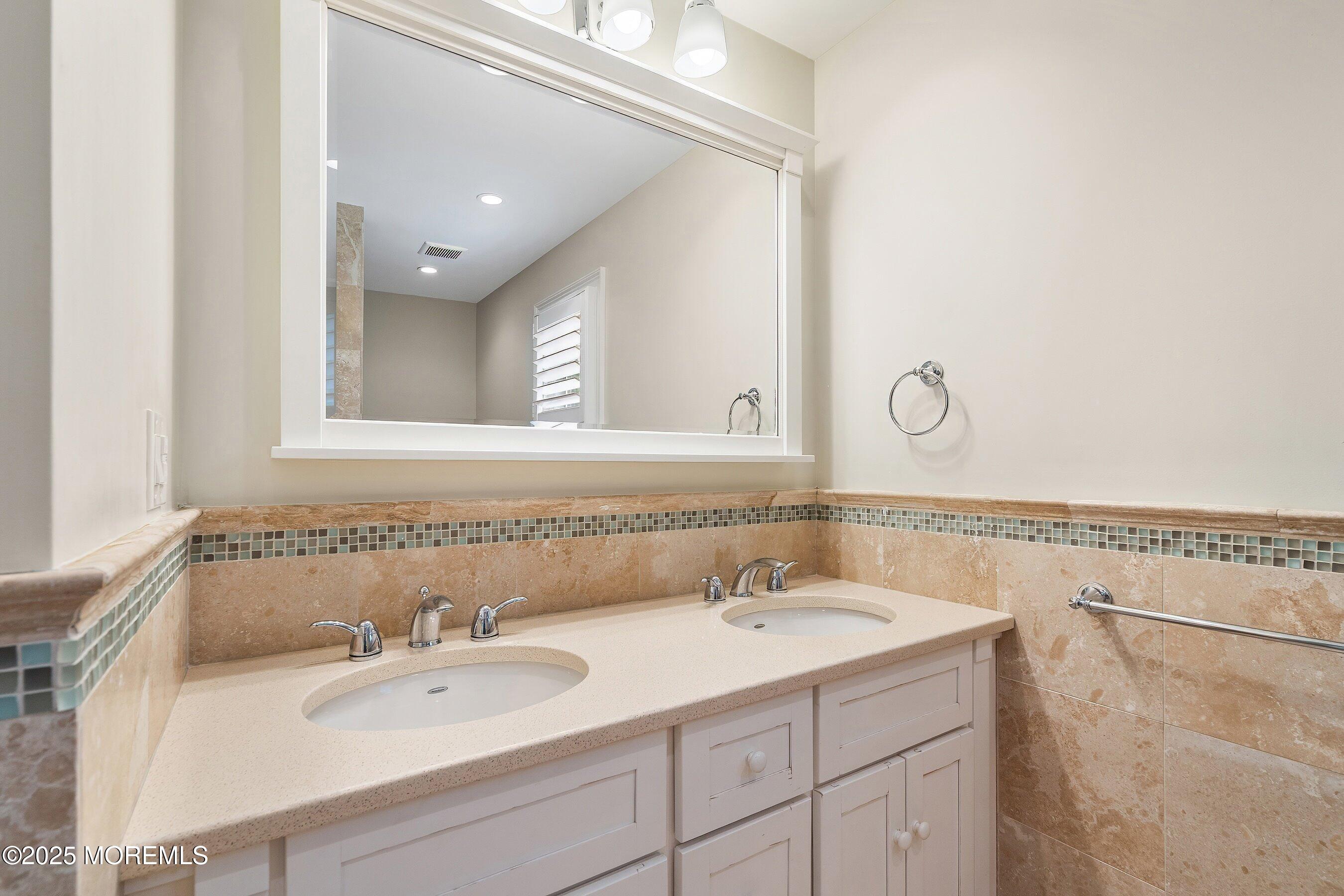 20 Rustic Terrace Fair Haven, NJ 07704 - Photo 24 of 40 a bathroom with a sink and a mirror