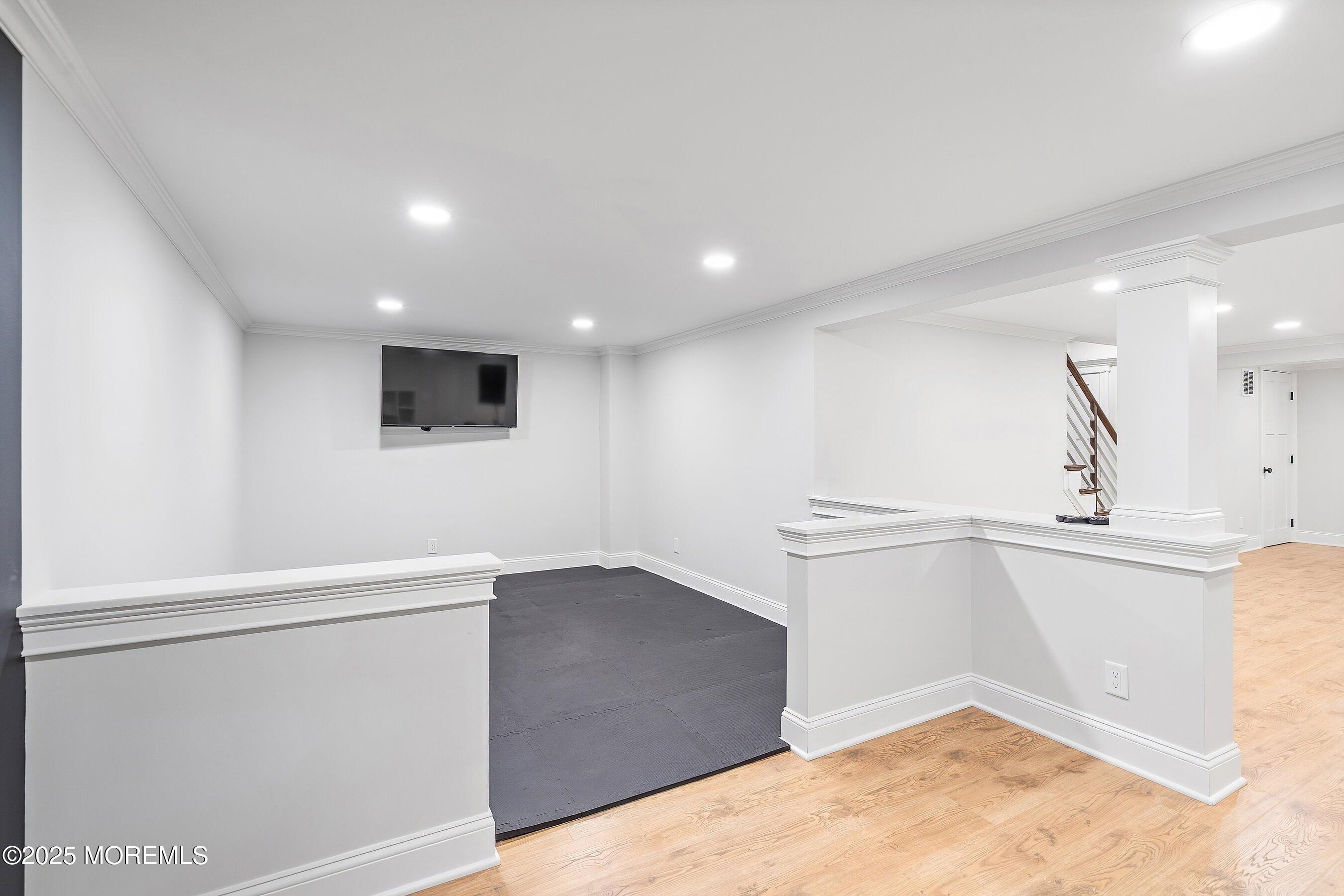20 Rustic Terrace Fair Haven, NJ 07704 - Photo 28 of 40 wooden floor in an empty room with a window