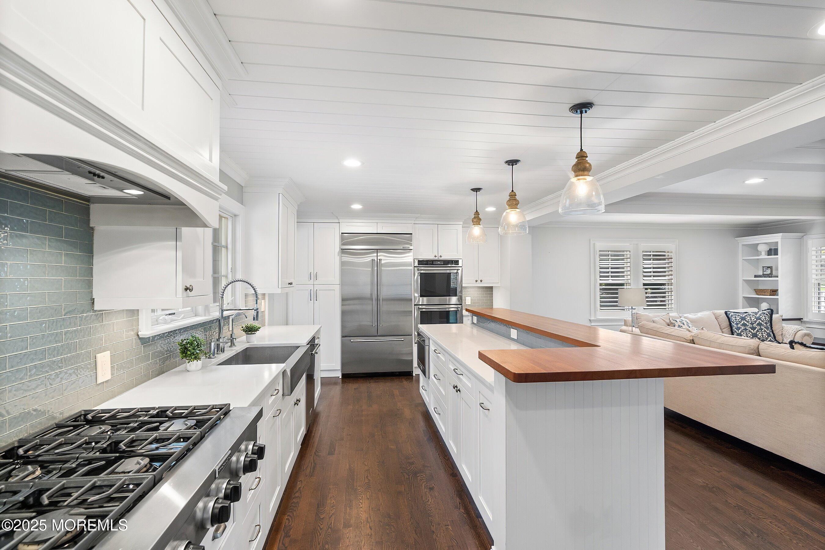 20 Rustic Terrace Fair Haven, NJ 07704 - Photo 3 of 40 a kitchen with stainless steel appliances granite countertop a sink stove and refrigerator