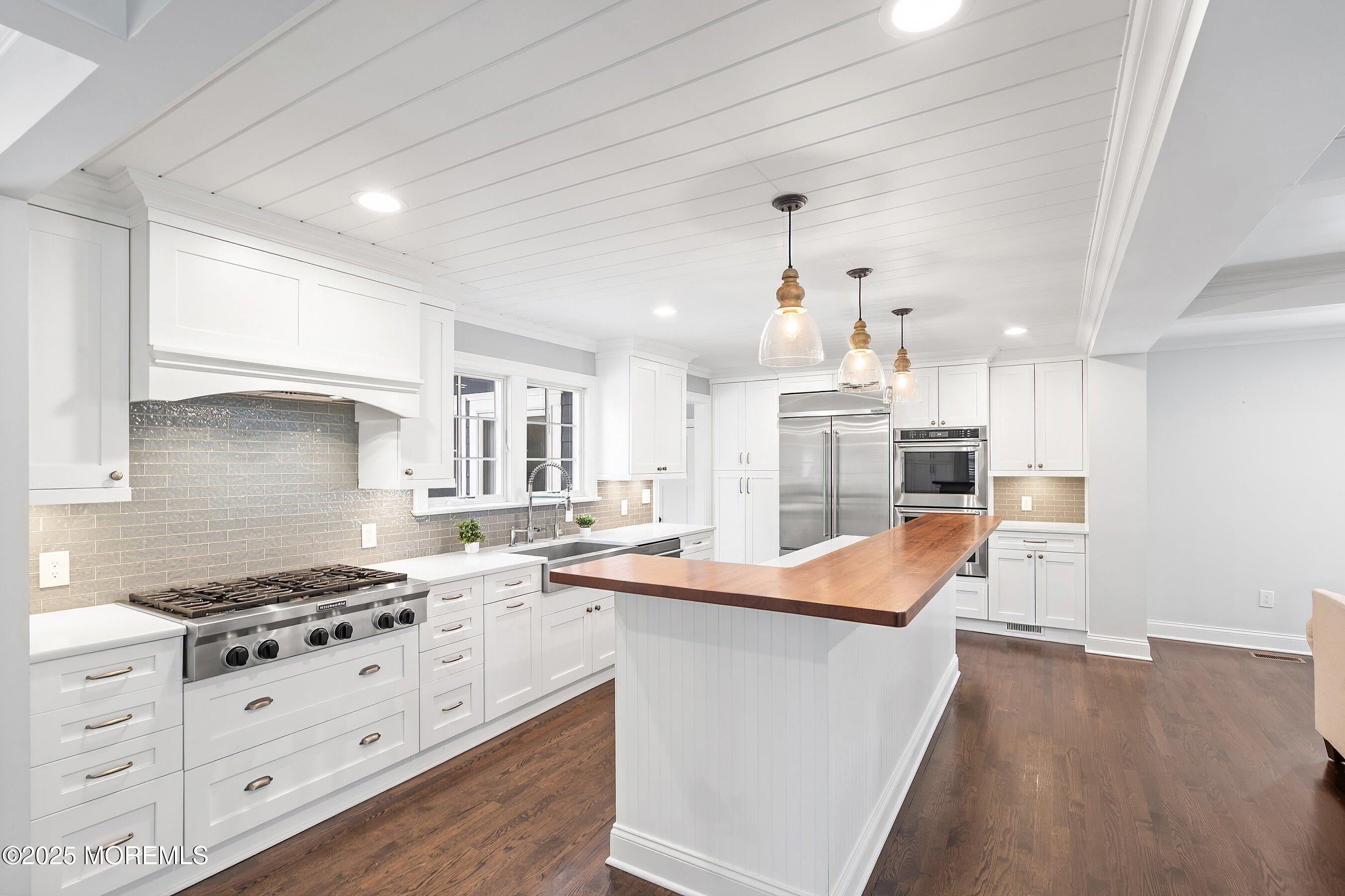 20 Rustic Terrace Fair Haven, NJ 07704 - Photo 5 of 40 a kitchen with stainless steel appliances kitchen island granite countertop a sink stove and refrigerator