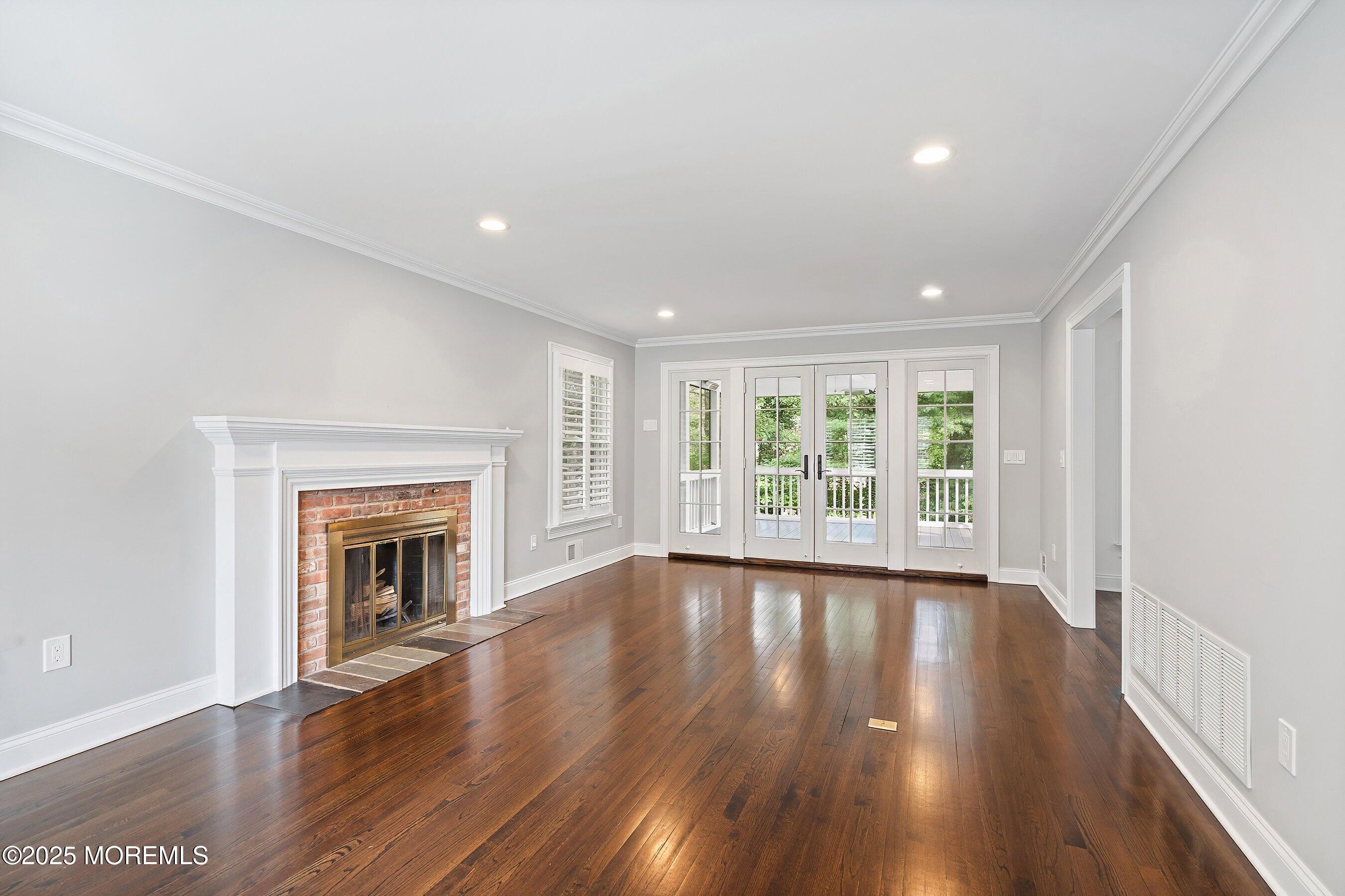 20 Rustic Terrace Fair Haven, NJ 07704 - Photo 8 of 40 a view of an empty room with wooden floor and a window